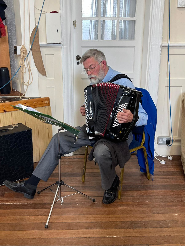 Richard playing his accordian